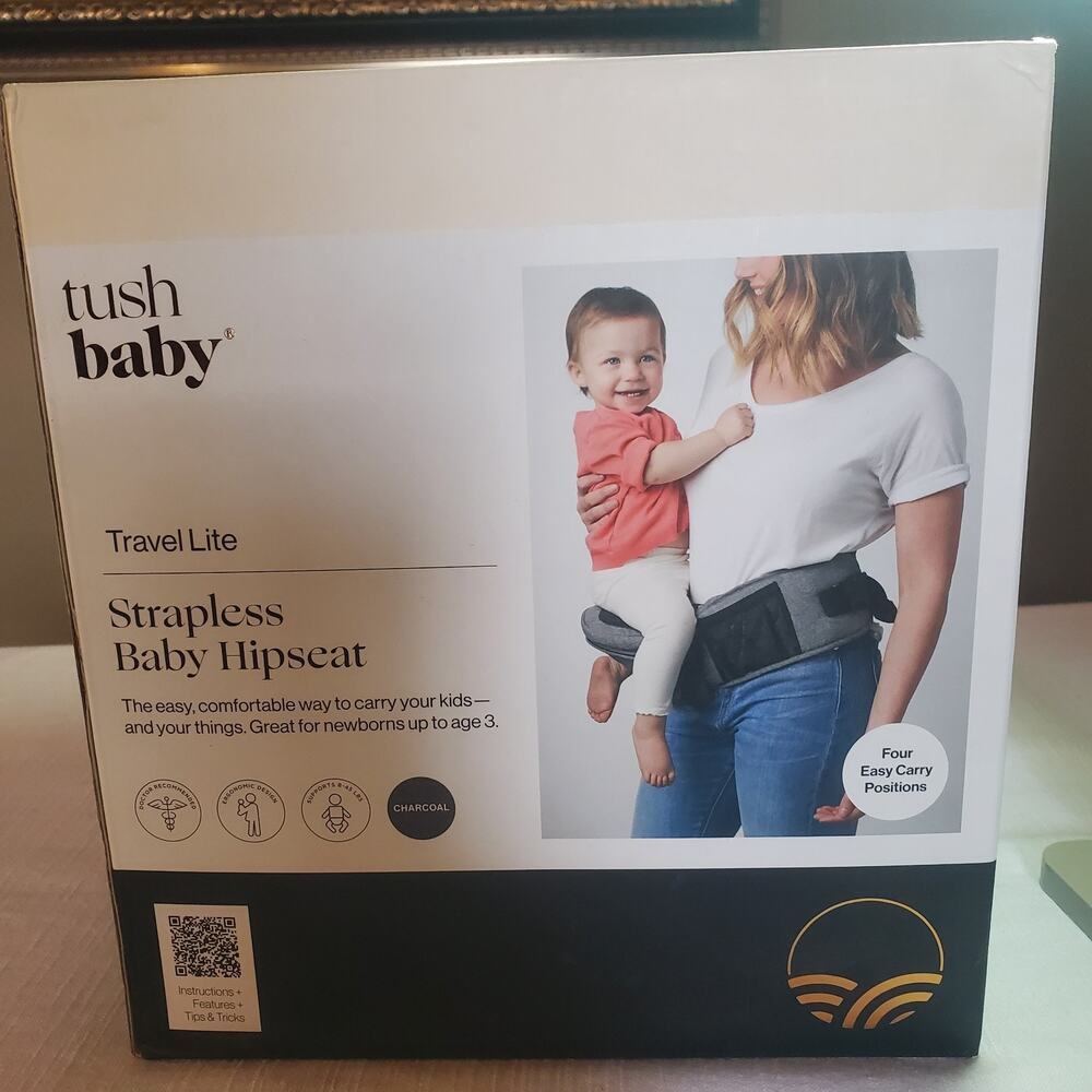 Tushbaby Travel Lite strapless baby hipseat in charcoal gray